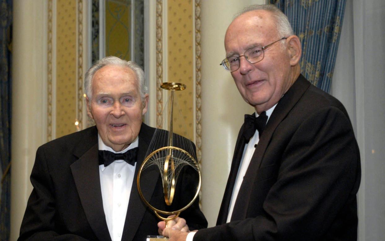 Gordon Moore, right, Intel Corporation co-founder, receives a Marconi Society Lifetime Achievement Award from Robert Galvin, chairman of Motorola in 2005 - AFP/Getty Images