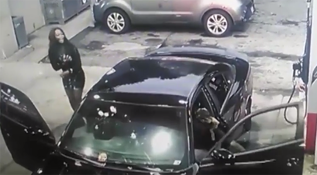 Bullets shatter the windscreen as a woman tries to flee the car. Source: International Business Times