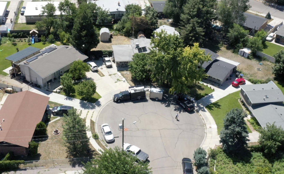 Law enforcement investigate the scene of a shooting involving the FBI Wednesday, Aug. 9, 2023 in Provo, Utah. A man accused of making threats against President Joe Biden was shot and killed by FBI agents hours before the president was expected to land in the state Wednesday, authorities said. (Laura Seitz/The Deseret News via AP)