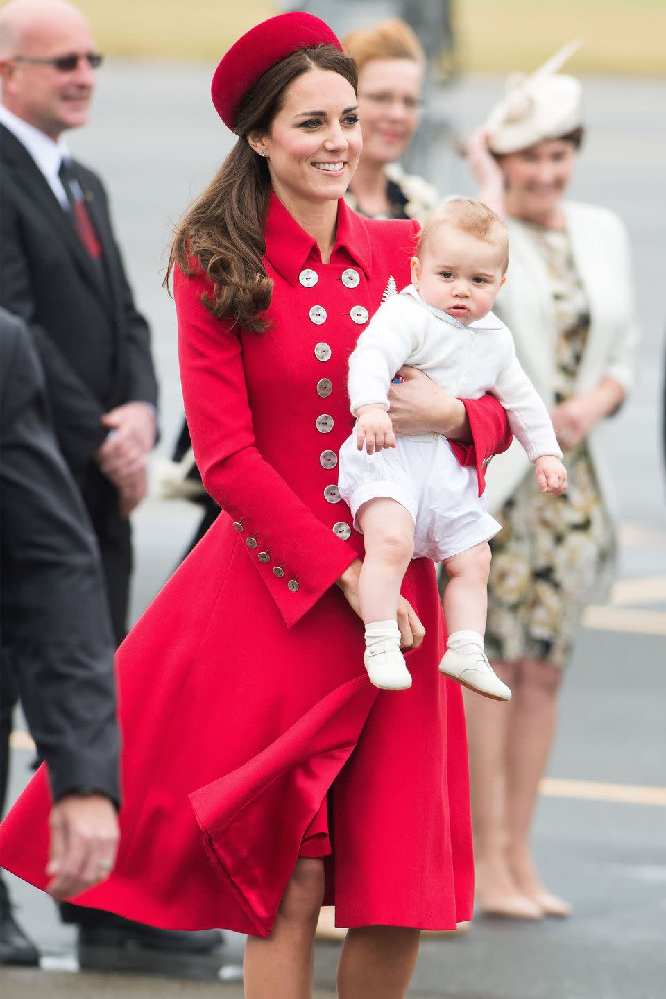 <p>Flawless in <a href="https://www.harpersbazaar.com/celebrity/red-carpet-dresses/g3827/kate-middleton-princess-diana-photos/" rel="nofollow noopener" target="_blank" data-ylk="slk:an all-red look;elm:context_link;itc:0;sec:content-canvas" class="link ">an all-red look</a>, Duchess Kate arrives holding Prince George in New Zealand.</p>
