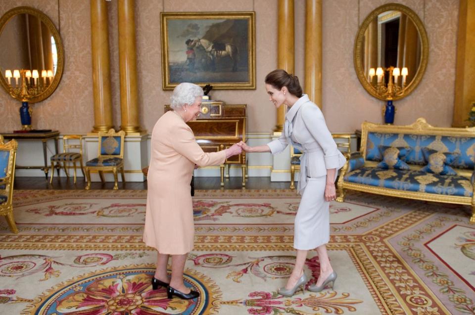 <p>Queen Elizabeth gifts actress Angelina Jolie an Honorary Dame Grand Cross award inside the 1844 Room. The grand space is one of the most important in the palace, and is used to greet distinguished guests. </p>