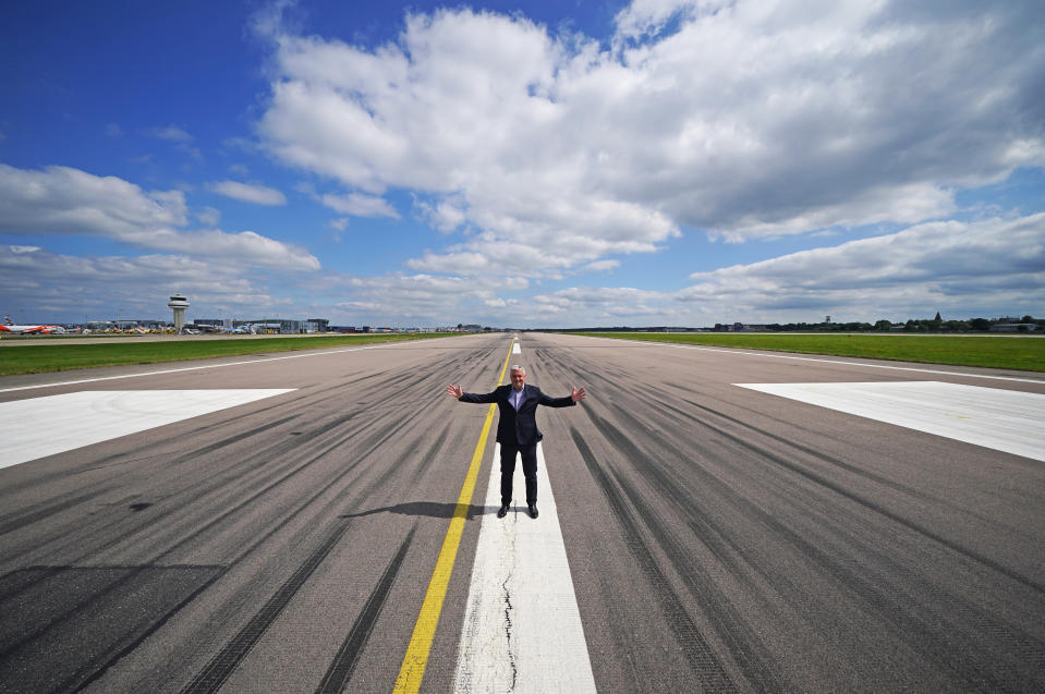 <p>Gatwick Airport's chief executive Stewart Wingate standing on the tarmac of the Northern Runway, after giving a press conference at the South Terminal of Gatwick Airport, West Sussex, to discuss plans to use the airport's emergency runway for routine flights. Picture date: Wednesday August 25, 2021.</p>
