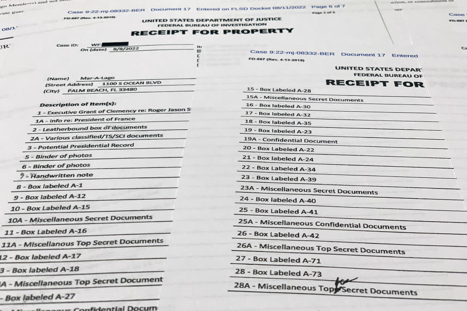 The receipt for property that was seized during the execution of a search warrant by the FBI at former President Donald Trump's Mar-a-Lago estate in Palm Beach, Fla., is photographed Friday, Aug. 12, 2022. (AP Photo/Jon Elswick)