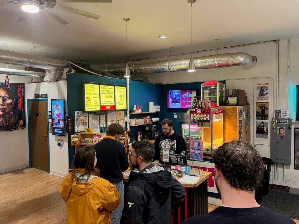 Patrons wait to buy tickets and concessions at Central Cinema last month.