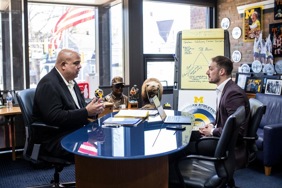 Michigan athletic director Warde Manuel talks during an interview with the Free Press Michigan beat writer Tony Garcia at U-M's Weidenbach Hall in Ann Arbor on Monday, April 22, 2024. 

U-M football head coach Sherrone Moore speaks to media at Al Glick Field House in Ann Arbor on Monday, April 22, 2024.