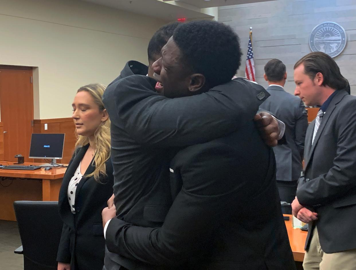 Two former Ohio State University football players, Amir I. Riep and Jahsen L. Wint (foreground), both 24, embrace Thursday after a Franklin County jury found them not guilty of rape and kidnapping charges. A then-19-year-old female had accused them of raping her on Feb. 4, 2020 in their Northwest Side apartment.