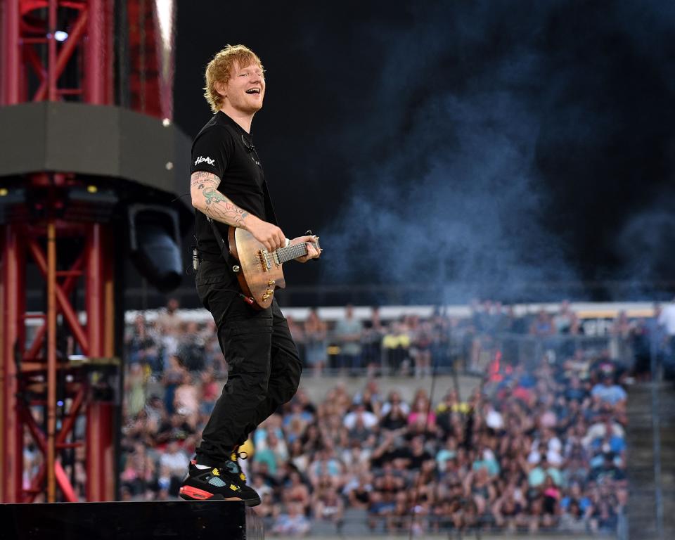 Ed Sheeran at the edge of the Acrisure Stadium stage.