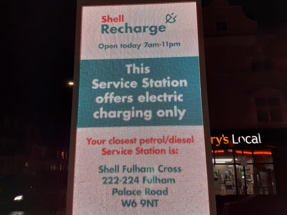 A sign at Shell Recharge garage in Fulham, directs motorists to the nearest petrol or diesel station.