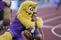 Gold medalist Sydney McLaughlin, of the United States, is embraced after winning the final of the women's 400-meter hurdles at the World Athletics Championships on Friday, July 22, 2022, in Eugene, Ore. (AP Photo/Ashley Landis)