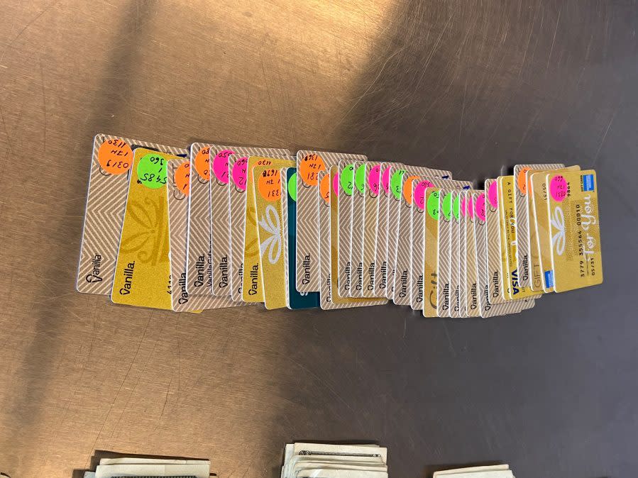 An array of cloned EBT cards are laid out in a photo shared by the Orange County District Attorney's Office on Jan. 19, 2024.