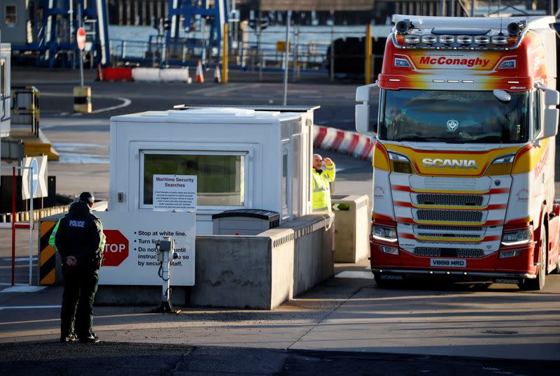 FILE PHOTO: Police officers stand by port security at the entrance to the Port of Larne