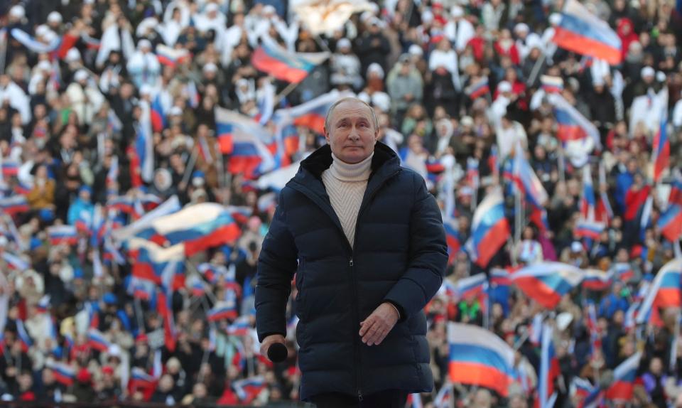 Russian President Vladimir Putin attends a concert marking the eighth anniversary of Russia's annexation of Crimea at the Luzhniki stadium in Moscow on March 18, 2022. (Photo by Mikhail KLIMENTYEV / SPUTNIK / AFP) (Photo by MIKHAIL KLIMENTYEV/SPUTNIK/AFP via Getty Images)