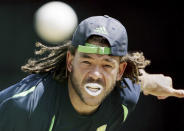 FILE - Australia's Andrew Symonds bowls in the nets during a traiing session on April 15, 2007, at the National Stadium at St. George's, Grenada. The former Australian test cricketer was killed in an auto crash near Townsville in northeast Australia on Saturday night, May 14, 2022, Cricket Australia said. He was 46. (AP Photo/Rick Rycroft, File)
