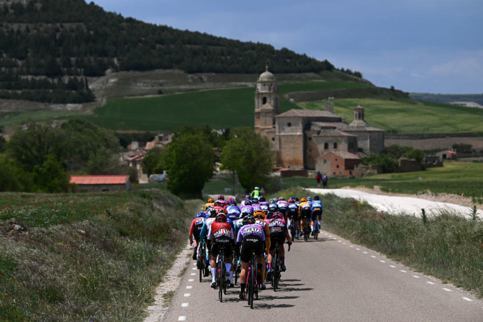 LERMA SPAIN  MAY 19 A general view of the peloton passing through Castrojeriz Village during the 8th Vuelta a Burgos Feminas 2023 Stage 2 a 1189km stage from Sotresgudo to Lerma  UCIWWT  on May 19 2023 in Lerma Spain Photo by Dario BelingheriGetty Images