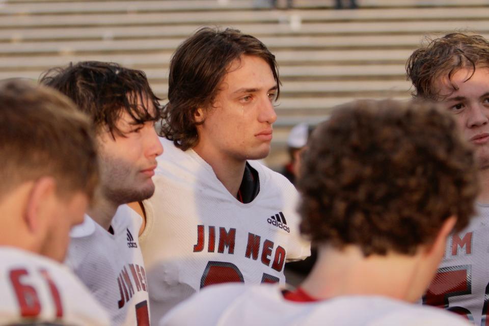 Jim Ned senior Ben Eshelman sheds a tear with his fellow seniors after taking the field for the last time. The senior class was crucial in helping Jim Ned win the state championship in 2020.