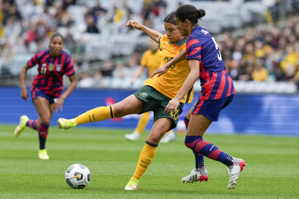 Matilda's Sam Kerr, left, and United States' Alana Cook battle for the ball during the international soccer match between the United States and Australia at Stadium Australia in Sydney, Saturday, Nov. 27, 2021. (AP Photo/Mark Baker)