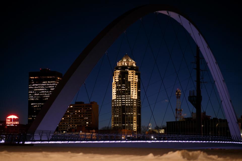 The Des Moines skyline is seen through the Women of Achievement bridge on Friday, Feb. 5, 2021, in Des Moines.
