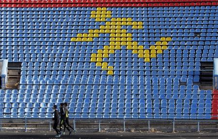 Sportsmen train at a local stadium in the southern city of Stavropol, Russia, November 10, 2015. REUTERS/Eduard Korniyenko