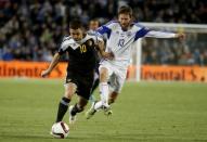 Belgium's Eden Hazard fights for the ball with Israel's Sheran Yeini during their Euro 2016 Group B qualifying soccer match at Teddy Stadium in Jerusalem March 31, 2015. REUTERS/ Ronen Zvulun