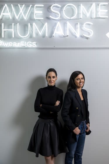 Heather Hasson, left and Trina Spear, co-CEOs and co-founders of the healthcare apparel company FIGS