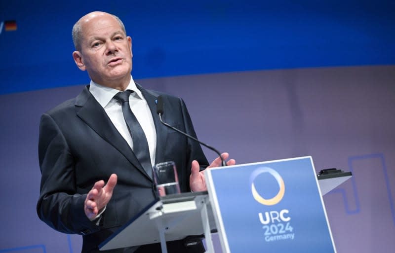 German Chancellor Olaf Scholz speaks at a joint press conference with Ukrainian President Volodymyr Zelensky during the International Ukraine Reconstruction Conference in Berlin.  Britta Pedersen/dpa