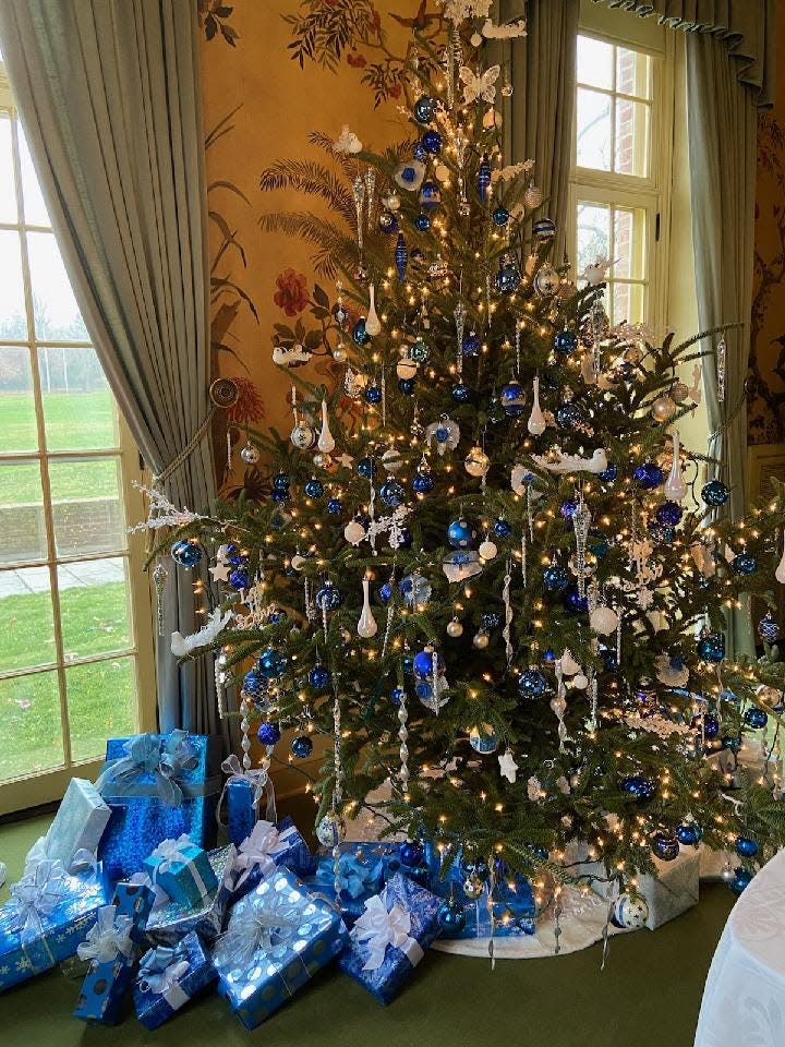 This tree and gifts below are part of the blue emphasis in the dining room brought to Kingwood Hall's mansion for the holidays by the Earth, Wind and Flowers Garden Club.