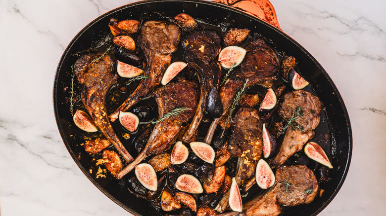 A pan of roasted lamb chops with thyme and figs