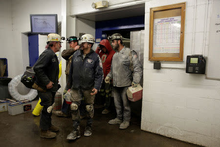 Miners starting and end their shifts greet each other at the Century Mine in Beallsville, Ohio, U.S., November 7, 2017. REUTERS/Joshua Roberts