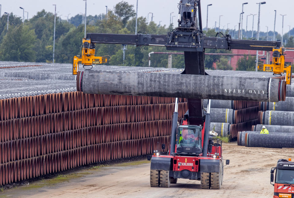 08 September 2020, Mecklenburg-Western Pomerania, Mukran: A special vehicle transports a pipe for the Nord Stream 2 natural gas pipeline to a storage yard at the port of Mukran on the island of Rügen. Special ships are currently being prepared in the port for use in the further construction of the Nord Stream 2 Baltic Sea pipeline. Photo: Jens Büttner/dpa-Zentralbild/dpa (Photo by Jens Büttner/picture alliance via Getty Images)