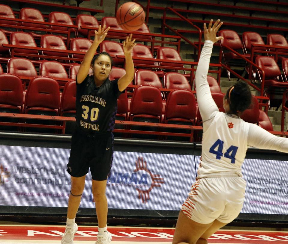 Kirtland Central's Jaymie Smart fires a 3-pointer against Los Lunas' Feleena Candelaria during the 4A girls basketball state championship on Friday, March, 13, 2020 at Dreamstyle Arena in Albuquerque. Los Lunas won, 47-33.