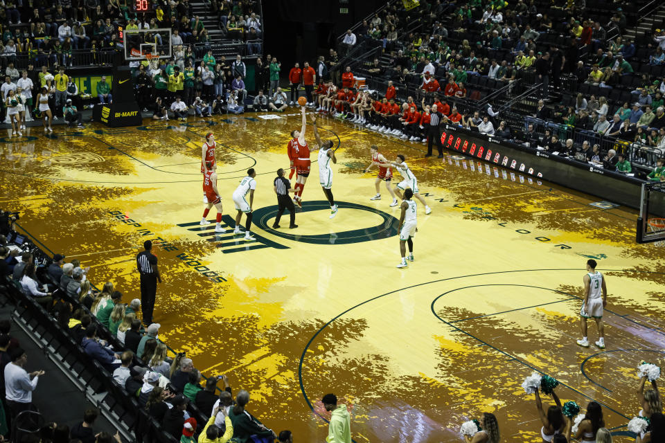 Oregon plays Utah during the first half of an NCAA college basketball game in Eugene, Ore., Saturday, March 9, 2024. This will be the last regular season Pac-12 game played on Oregon's controversial floor. (AP Photo/Thomas Boyd)