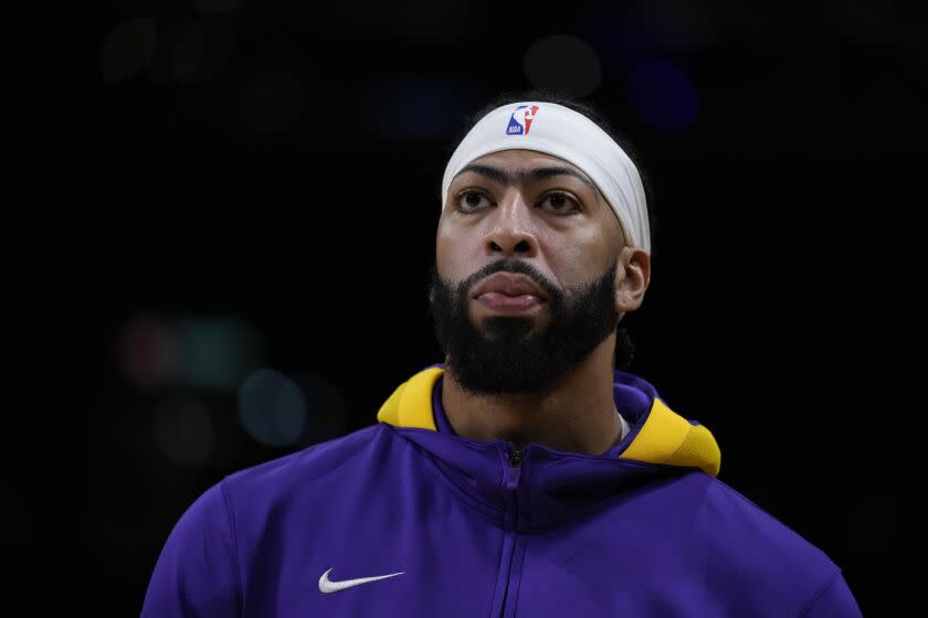 Los Angeles Lakers' Anthony Davis stands on the court during warmups.