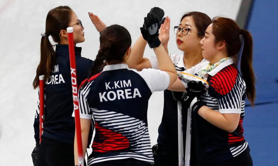 Kim Eun-jung, Kim Kyeong-ae, Kim Seon-yeong and Kim Cho-hi of South Korea celebrate after beating Olympic Athletes from Russia.