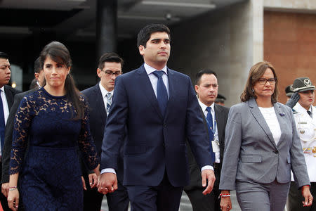Ecuador's new vice president Otto Sonnenholzner, flanked by his wife Claudia Salem and President of the Congress lawmaker Elizabeth Cabezas, leavee the Congress after his swearing-in ceremony in Quito, Ecuador December 11, 2018. REUTERS/Daniel Tapia
