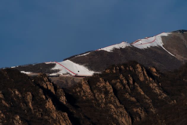 A ski slope at the Beijing Winter Olympics runs on a nearly snowless mountains on Jan. 28. (Photo: via Associated Press)