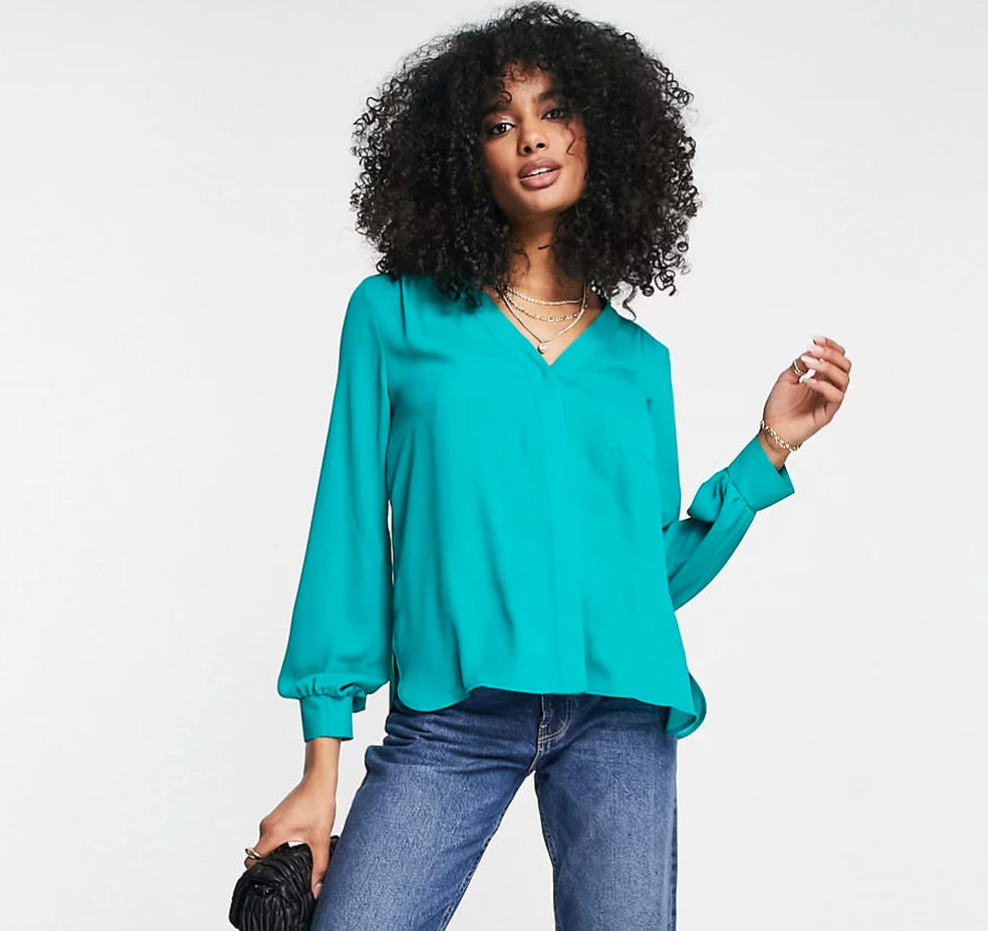 Woman wearing teal blouse from ASOS