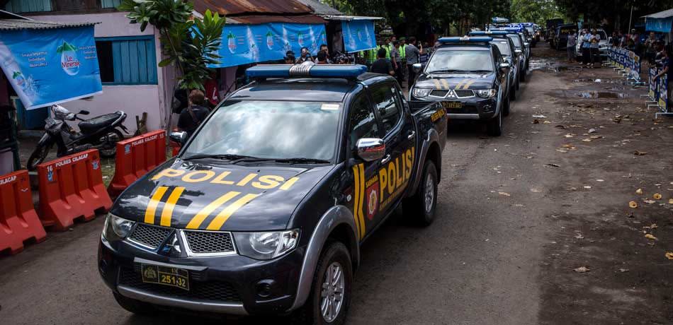 Indonesian police patrol cars are arrive at Wijayapura port, which is the entrance gate to Nusakambangan prison as Indonesia prepare for third round of drug executions on July 27, 2016 in Cilacap, Central Java, Indonesia. According to reports, Indonesia is likely to resume executions of 14 prisoners on death row this week. Fourteen prisoners, including inmates from Nigeria, Pakistan, India, South Africa, and four Indonesians, have been moved to isolation holding cells at Nusa Kambangan, off Central Java.