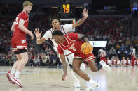 Wisconsin guard AJ Storr (2) works toward the basket as Illinois guard Terrence Shannon, back, defends during the first half of an NCAA college basketball game in the championship of the Big Ten Conference tournament, Sunday, March 17, 2024, in Minneapolis. (AP Photo/Abbie Parr)