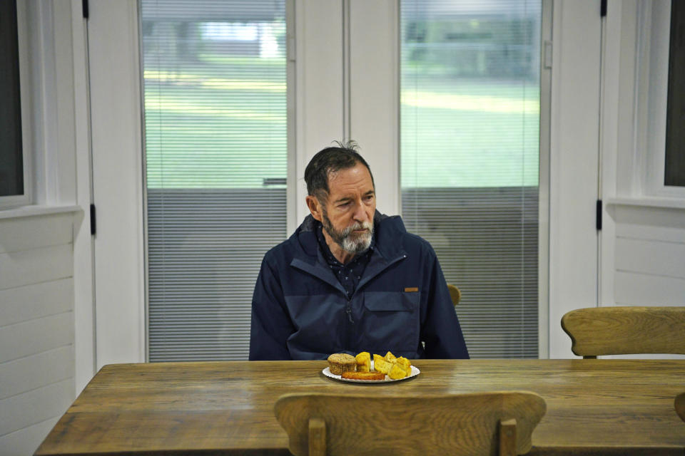 Jim Champion, 75, eats breakfast. (Aileen Perilla / for NBC News)