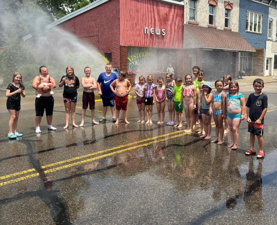 Newcomerstown opened a fire hydrant on Main Street so residents could cool down during the recent heat wave. Popsicles were passed out from Main Street Coffee as well as pizza from Domino’s of Newcomerstown
