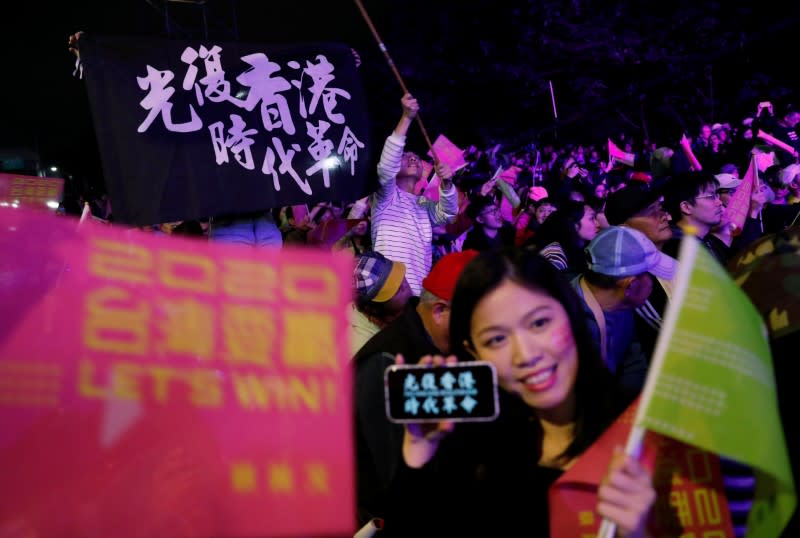 Hong Kong anti-government protesters attend a rally in support of Taiwan President Tsai Ing-wen outside the Democratic Progressive Party (DPP) headquarters in Taipei