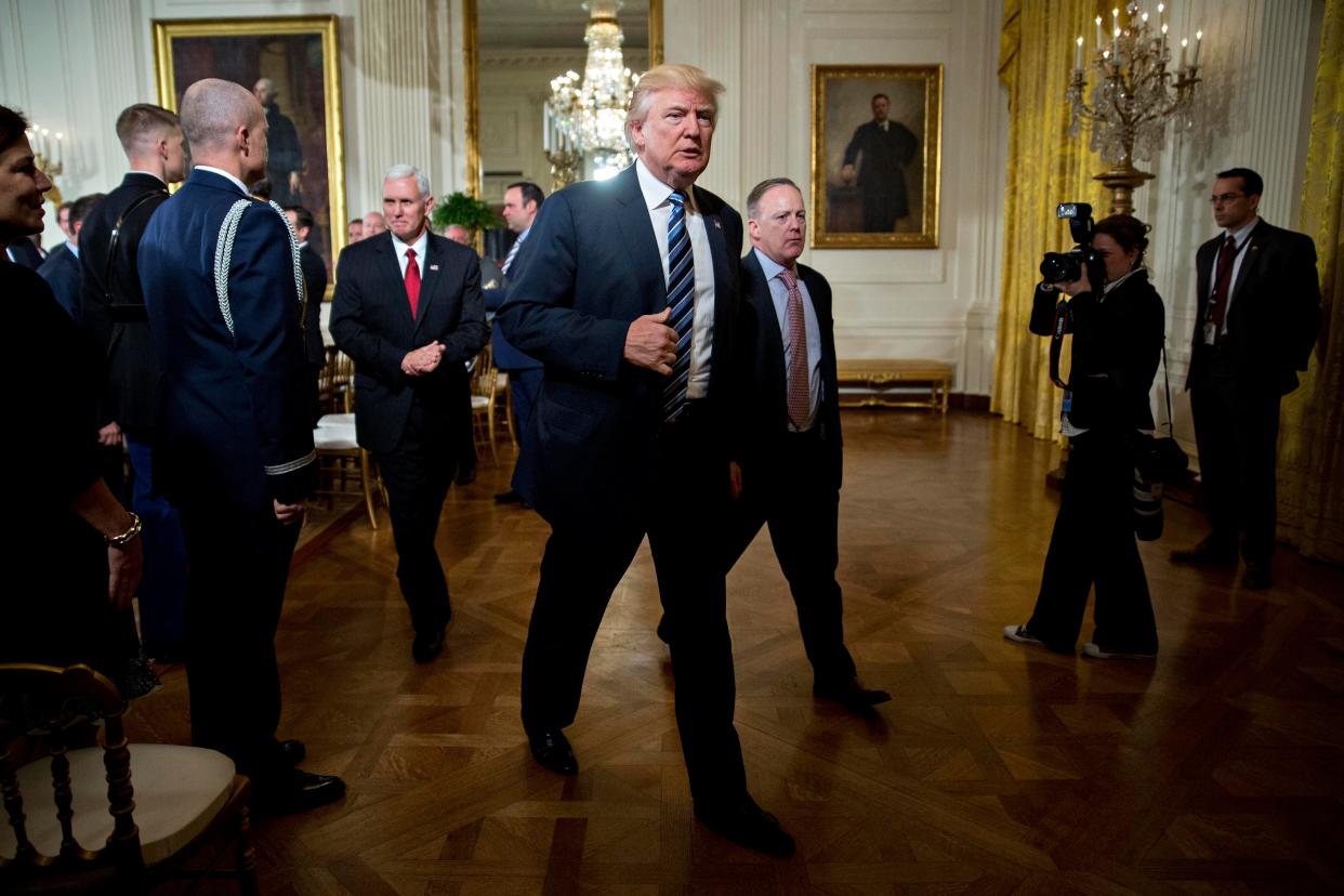 Donald Trump with vice president Mike Pence and Sean Spicer, White House press secretary, in episode 1 of ‘The Trump Show’ (Getty)