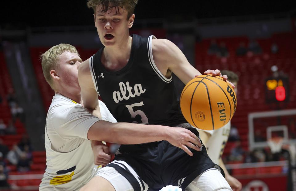 Bonneville’s Jake Williams (4) defends Alta’s Jaxon Johnson (5) during the boys 5A basketball state quarterfinals at the Huntsman Center in Salt Lake City on Monday, Feb. 28, 2022. | Mengshin Lin, Deseret News