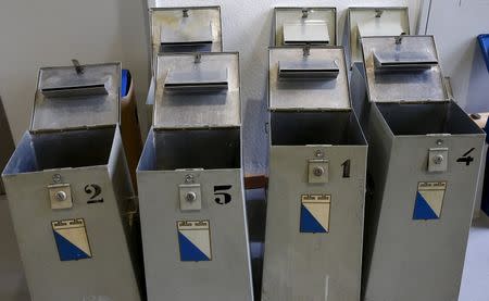 Empty ballot boxes stand at an election office in Zurich, Switzerland, October 18, 2015. REUTERS/Arnd Wiegmann