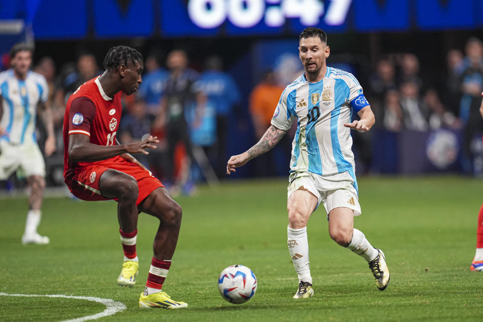 Jun 20, 2024; Atlanta, GA, USA; Argentina forward Lionel Messi (10) plays the ball against Canada defender Moise Bombito (15) during the second half at Mercedez-Benz Stadium. Mandatory Credit: Dale Zanine-USA TODAY Sports