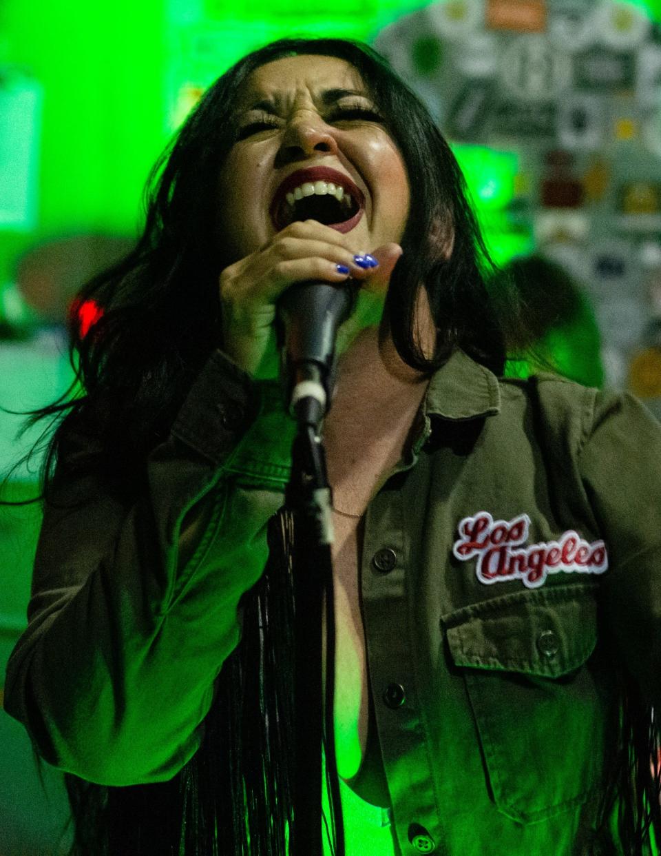 Local musician and visual artist Cakes (Monica Morones) performing a show at Coachella Valley Brewing Company in Thousand Palms, Calif., in 2022.
