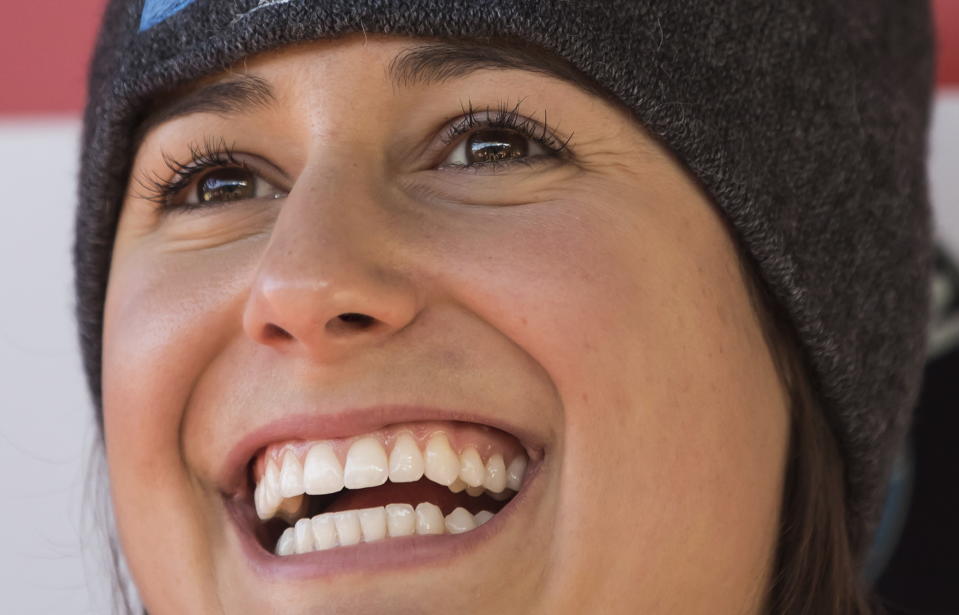 Emily Sweeney, of the United States, smiles after racing to a third-place finish during a World Cup women's luge event in Whistler, British Columbia, on Saturday, Dec. 1, 2018. (Darryl Dyck/The Canadian Press via AP)