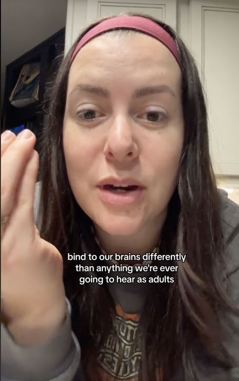 Nikki in a tiktok, caption reads: bind to our brains differently than anything we're ever going to hear as adults