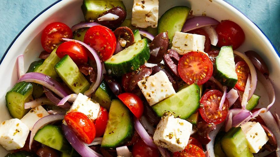 greek salad with cucumber, tomatoes, red onion, olives, and feta