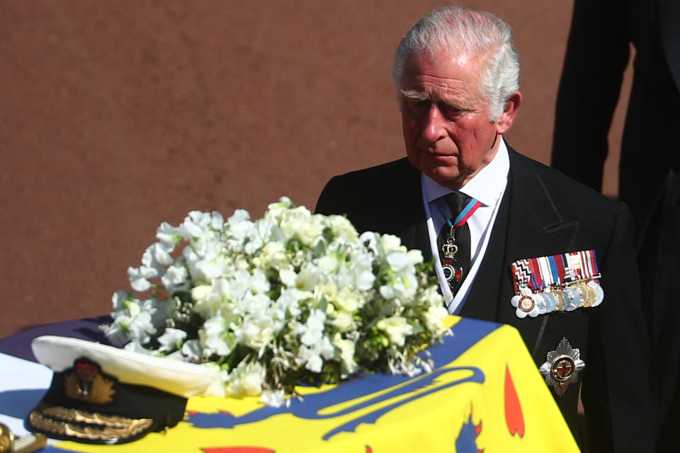 Prince Charles walking behind Prince Philip's coffin